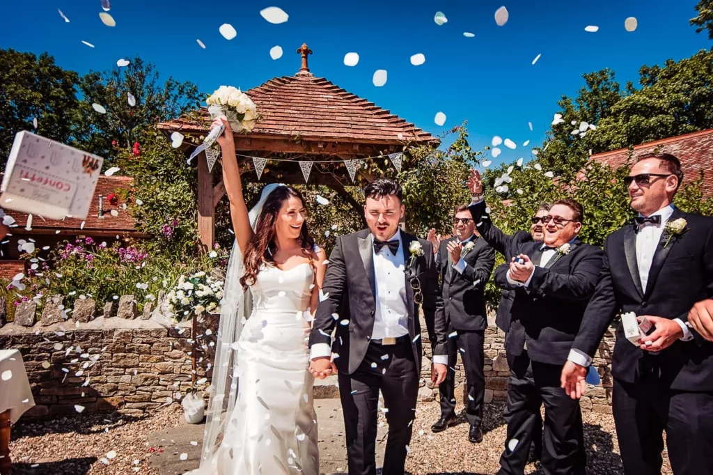 One Thousand Words couple celebrating getting married outdoors at Kingston Country Courtyard